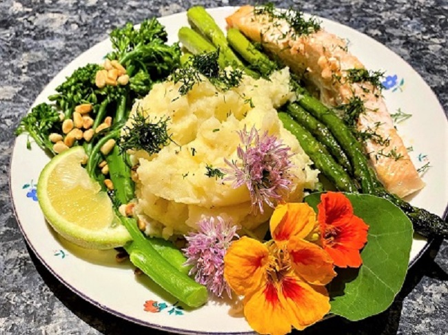 Salmon with floral garnish