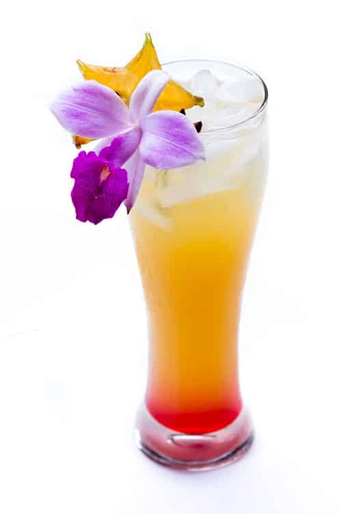 no tequila sunrise with orchid garnish