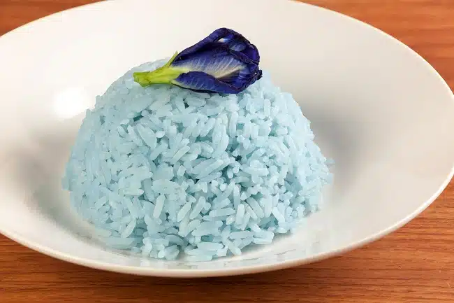 bowl of rice colored blue with natural butterfly pea flower colorant